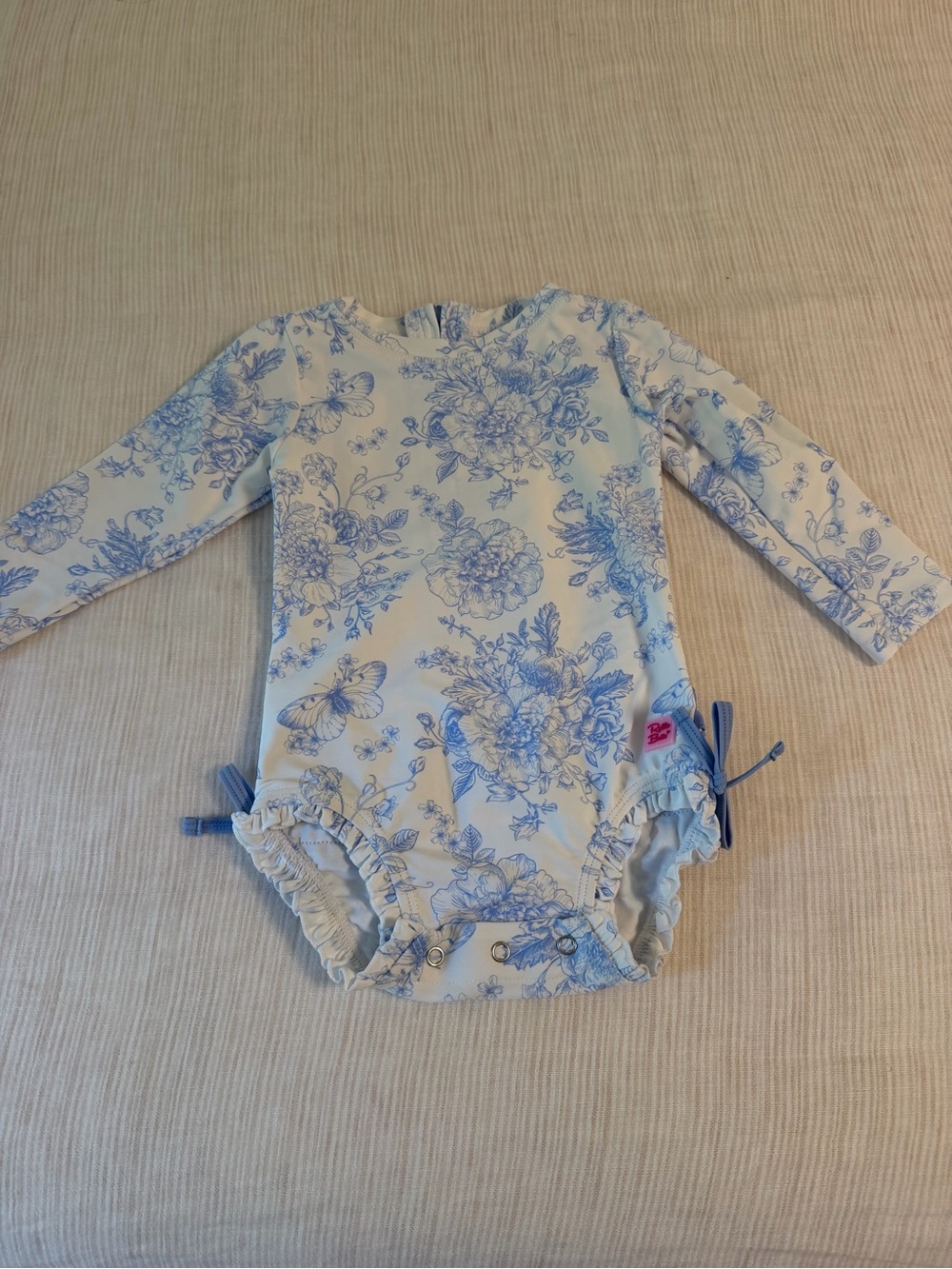 Ruffle Butts Blue and White Floral Long-Sleeve One-Piece Swimsuit